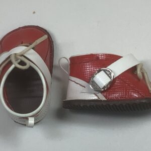 Item# BT163 / Red vinyl ski boots / unknown creator