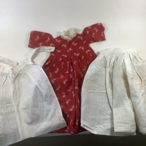 Item# SC062 / Red dress with petticoat and apron, needs new fasteners / unknown creator